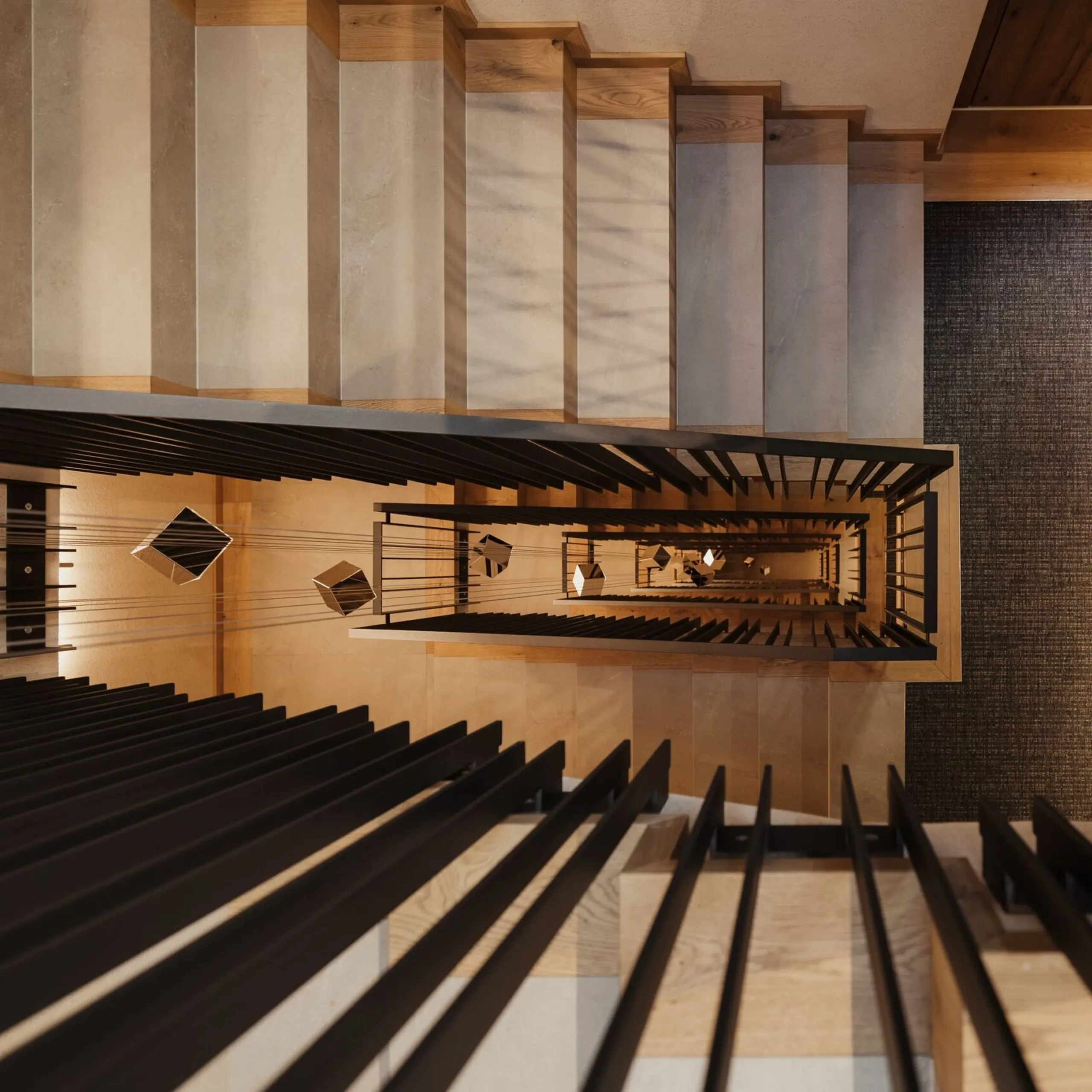 Vista dall'alto di una scala interna con parapetti neri e gradini in legno chiaro, un pozzo verticale che forma motivi geometrici verso il basso.